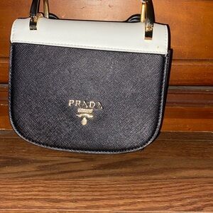 I am selling my Prada purse, it has only been used maybe a handful of times.